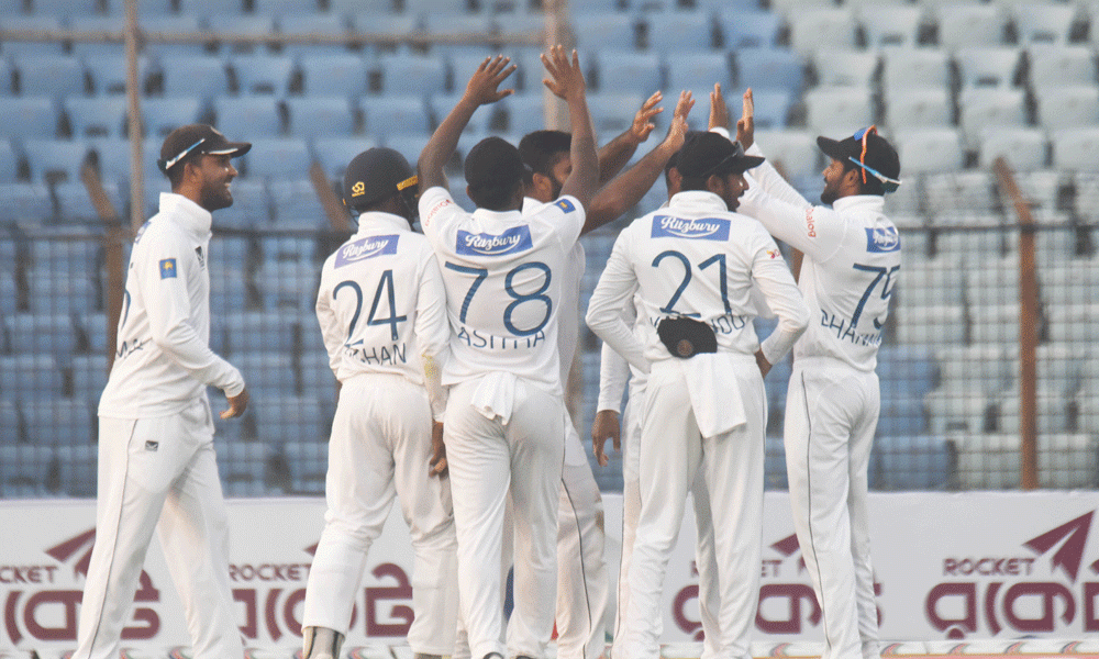 Sri Lanka’s cricketers celebrate during the second day of the second Test cricket match between Bangladesh and Sri Lanka at the Zahur Ahmed Chowdhury Stadium in Chittagong on March 31, 2024. Photo : Rafiqur Rahman Raqu