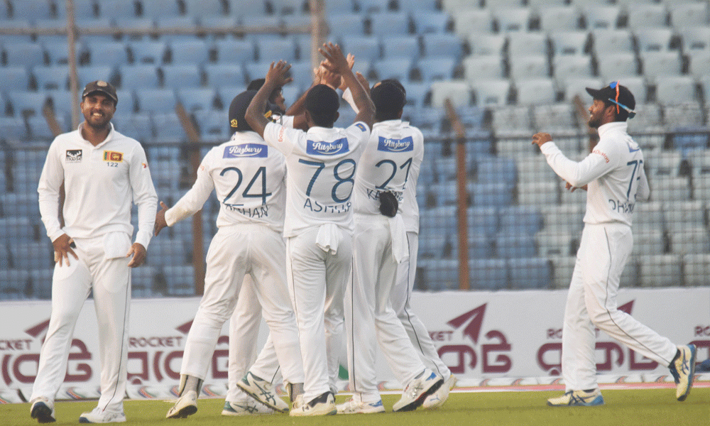 Sri Lanka’s cricketers celebrate during the second day of the second Test cricket match between Bangladesh and Sri Lanka at the Zahur Ahmed Chowdhury Stadium in Chittagong on March 31, 2024. Photo : Rafiqur Rahman Raqu