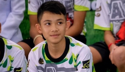 Boy who survived Thai cave rescue dies in UK