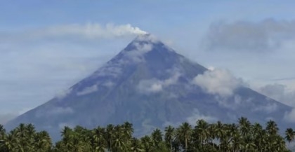 Rescuers climb Philippine volcano to reach plane crash site

