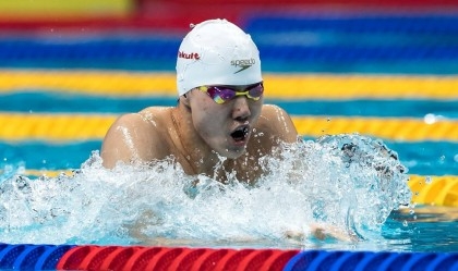 China's Qin wins men's 100m breaststroke world title
