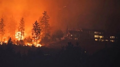 Mass evacuations in Canada province where 380 wildfires burn