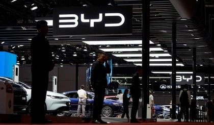 Chinese electric carmaker BYD triples half-year profit