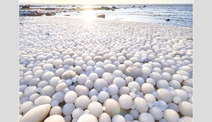 Thousands of rare ice eggs cover beach in Finland