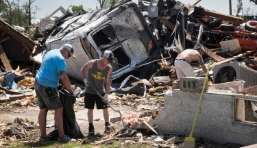 At least 15 dead in US tornadoes, storms