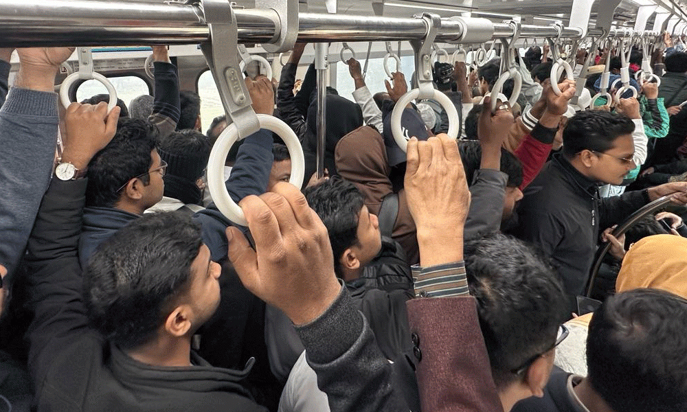 To avoid traffic jam during the rush hours, city dwellers opt to travel by metro rail. Since the metro started operating between Uttara to Motijheel all day, buses have been seeing fewer passengers than previous. The snapshot was taken from Pallabi Station area on Wednesday morning. Photo: Rafiqur Rahman Raqu