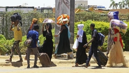 Thousands flee Sudan capital as clashes rage despite truce