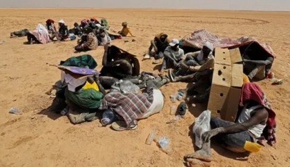Libya border guards rescue migrants in desert near Tunisia