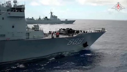 Russian and Chinese warships sail close to Japanese islands on eve of Biden’s trilateral summit

