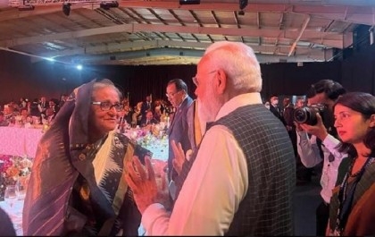 Modi walks to Sheikh Hasina to exchange pleasantries at dinner in Johannesburg