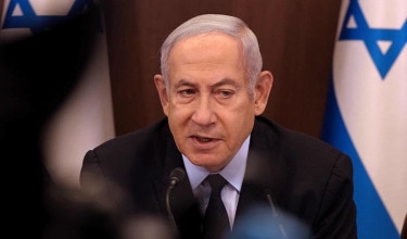 Netanyahu fights for political survival to beat of war drums