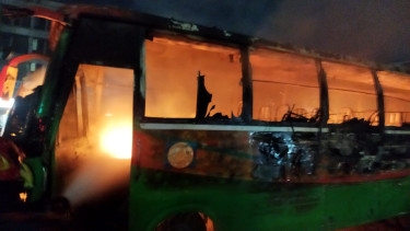 Bus torched under Hanif flyover in Jatrabari