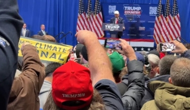 Climate protesters interrupt Trump event in Iowa